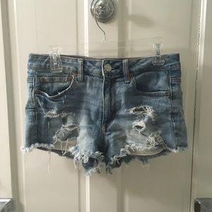 High rise festival shorts, ripped light wash